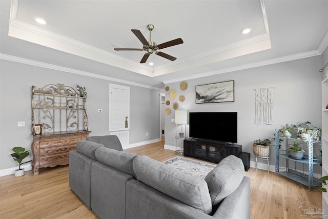 1223 Fenwick Ct, Cantonment, FL 32533 - living room with a tray ceiling, a ceiling fan, light wood finished floors, ornamental molding, and recessed lighting