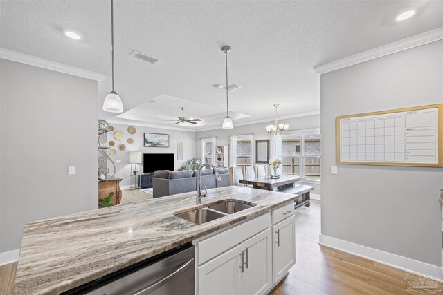 1223 Fenwick Ct, Cantonment, FL 32533 - kitchen featuring dishwasher, ornamental molding, white cabinetry, open floor plan, and light wood-type flooring