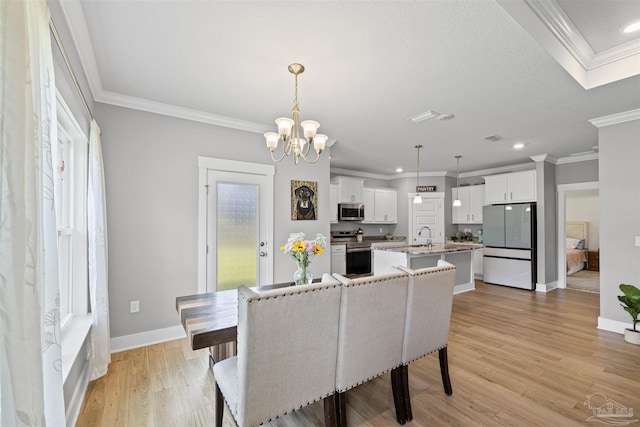 1223 Fenwick Ct, Cantonment, FL 32533 - dining room featuring crown molding, a chandelier, light wood finished floors, and recessed lighting