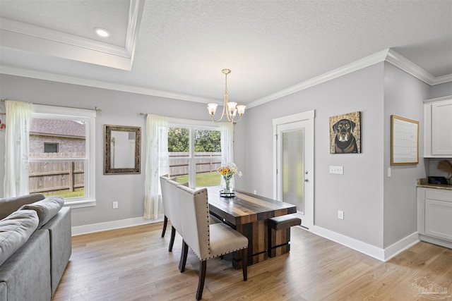 1223 Fenwick Ct, Cantonment, FL 32533 - dining area featuring a chandelier, crown molding, light wood-style floors, a textured ceiling, and recessed lighting