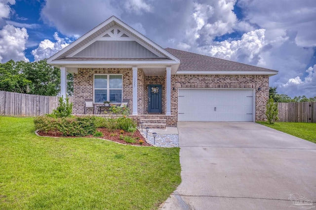 1223 Fenwick Ct, Cantonment, FL 32533 - single story home with brick siding, concrete driveway, a garage, a porch, and board and batten siding