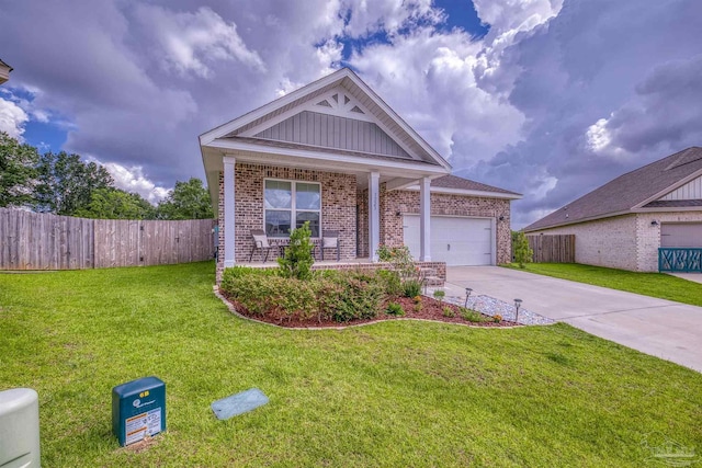 1223 Fenwick Ct, Cantonment, FL 32533 - ranch-style home with brick siding, concrete driveway, an attached garage, a porch, and board and batten siding