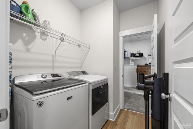 1223 Fenwick Ct, Cantonment, FL 32533 - washroom featuring washing machine and clothes dryer and light wood finished floors