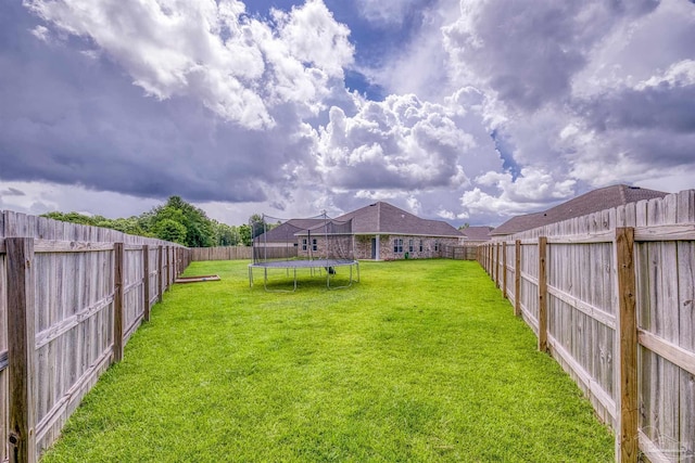 1223 Fenwick Ct, Cantonment, FL 32533 - fenced backyard with a trampoline