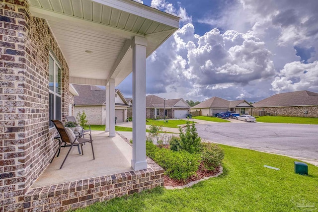 1223 Fenwick Ct, Cantonment, FL 32533 - view of grassy yard featuring a residential view and covered porch