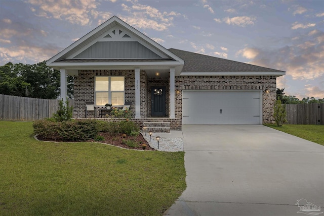 1223 Fenwick Ct, Cantonment, FL 32533 - view of front of property featuring brick siding, a porch, driveway, and an attached garage