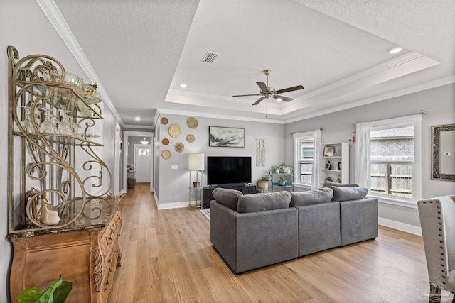 1223 Fenwick Ct, Cantonment, FL 32533 - living area featuring crown molding, a ceiling fan, a tray ceiling, light wood-style floors, and recessed lighting
