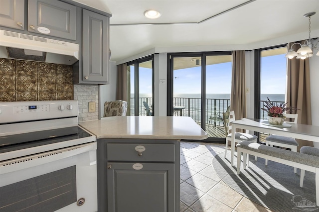 24230 Perdido Beach Blvd Unit 3087, Orange Beach, AL 36561 - kitchen with white range with electric stovetop, a healthy amount of sunlight, a water view, and tasteful backsplash
