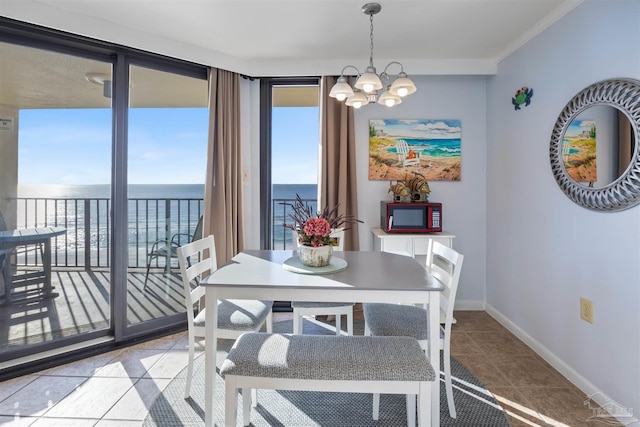 24230 Perdido Beach Blvd Unit 3087, Orange Beach, AL 36561 - tiled dining space featuring a water view and a notable chandelier