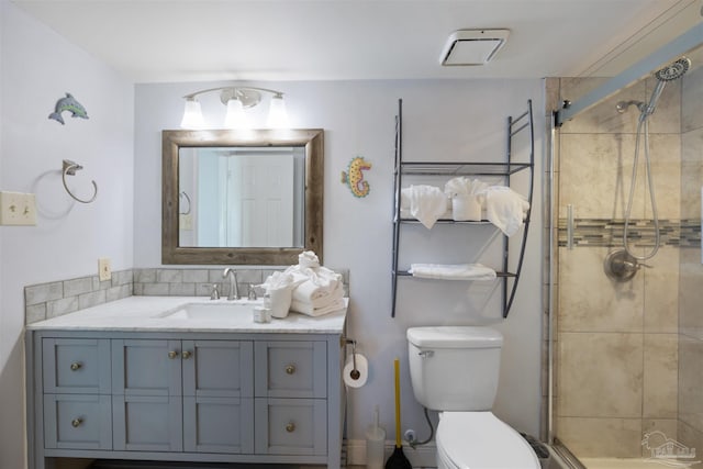 24230 Perdido Beach Blvd Unit 3087, Orange Beach, AL 36561 - bathroom featuring a shower with door, vanity, and toilet