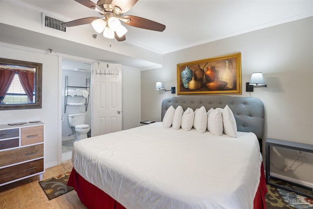 24230 Perdido Beach Blvd Unit 3087, Orange Beach, AL 36561 - bedroom with connected bathroom, light hardwood / wood-style flooring, ceiling fan, and crown molding