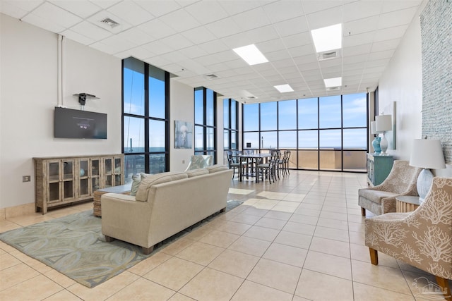 24230 Perdido Beach Blvd Unit 3087, Orange Beach, AL 36561 - living room with a healthy amount of sunlight, a wall of windows, and light tile patterned floors