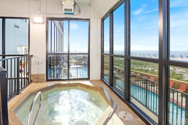 24230 Perdido Beach Blvd Unit 3087, Orange Beach, AL 36561 - unfurnished sunroom with a jacuzzi and a water view