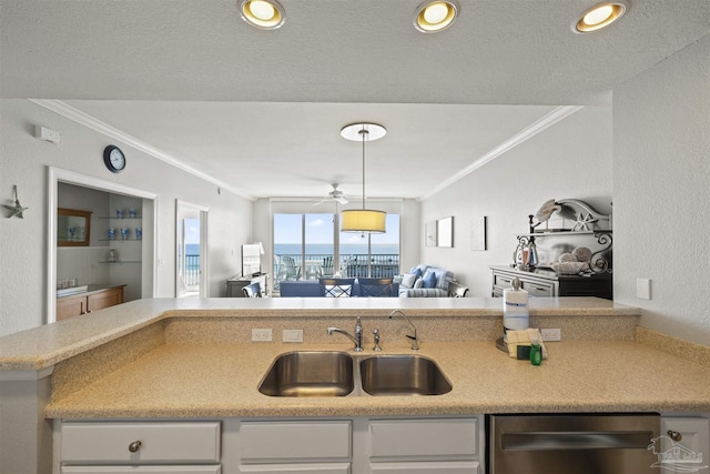 kitchen with ceiling fan, ornamental molding, dishwasher, and sink