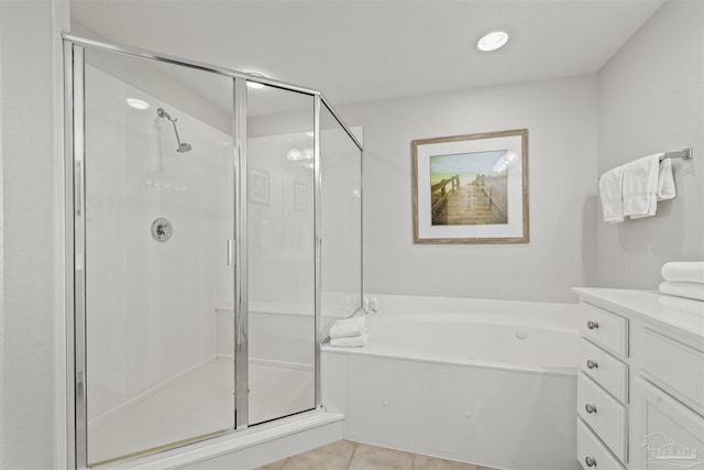 bathroom with shower with separate bathtub, tile patterned floors, and vanity