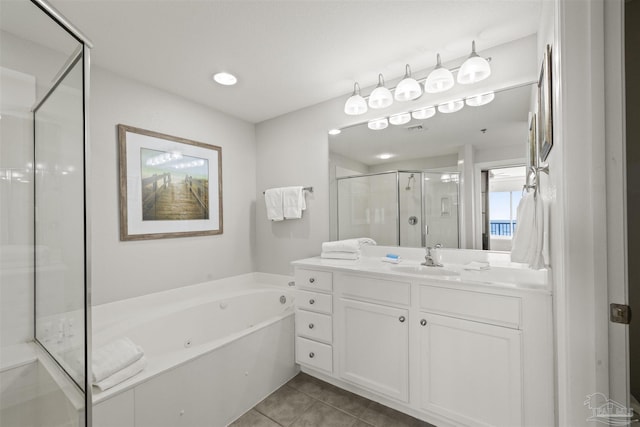 bathroom with independent shower and bath, tile patterned floors, and vanity