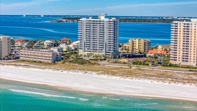 bird's eye view with a water view and a beach view