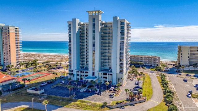 aerial view featuring a water view and a beach view