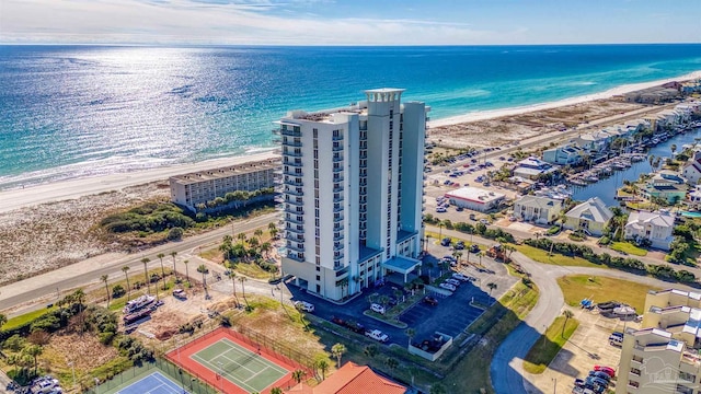 birds eye view of property featuring a water view and a beach view