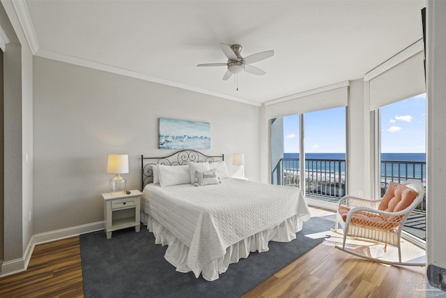 bedroom with dark wood-type flooring, ceiling fan, crown molding, and a water view