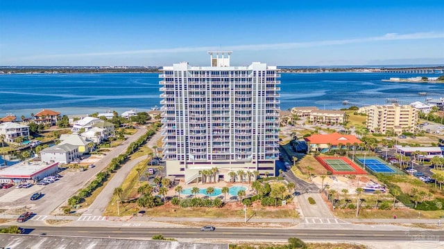 birds eye view of property with a water view