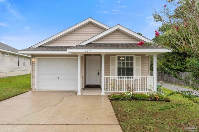 view of front facade with a porch, a garage, and a front yard