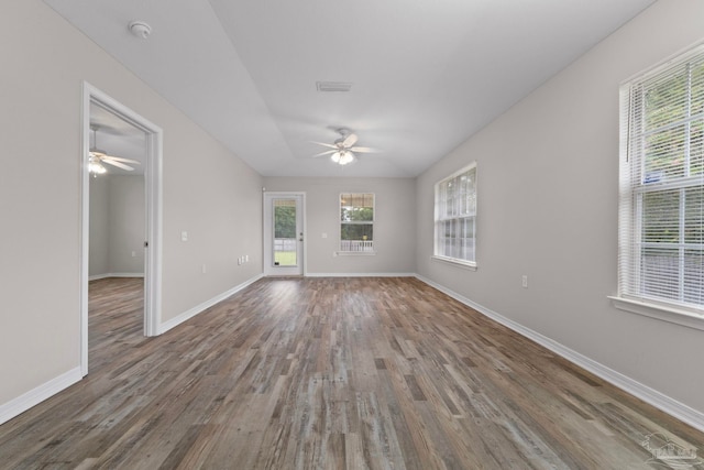 spare room featuring ceiling fan and dark hardwood / wood-style flooring