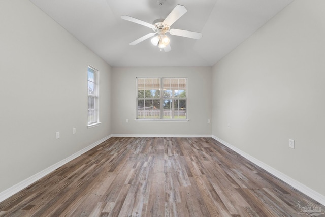 empty room with wood-type flooring and ceiling fan