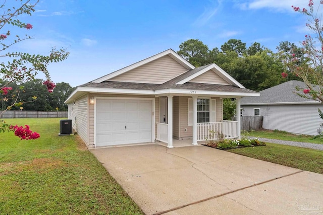 view of front of property featuring covered porch, a garage, central AC unit, and a front yard