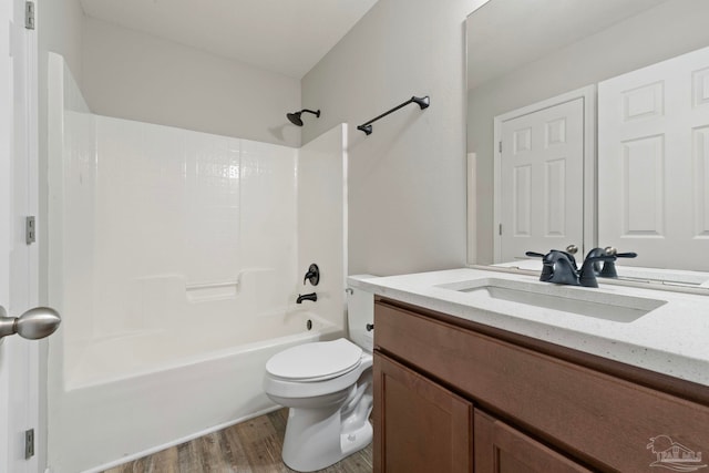 full bathroom featuring vanity, toilet, shower / bath combination, and hardwood / wood-style flooring