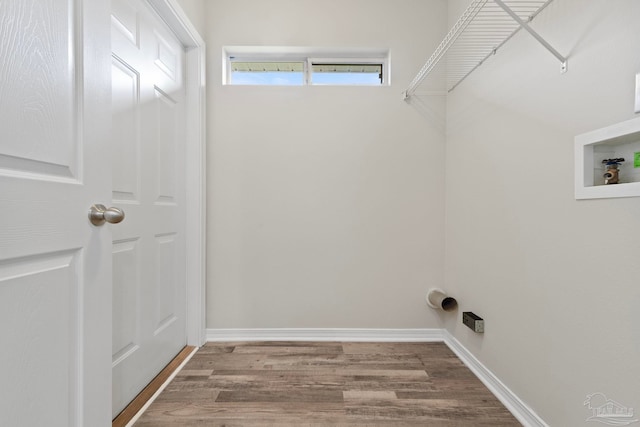 laundry area with hookup for a washing machine and hardwood / wood-style floors