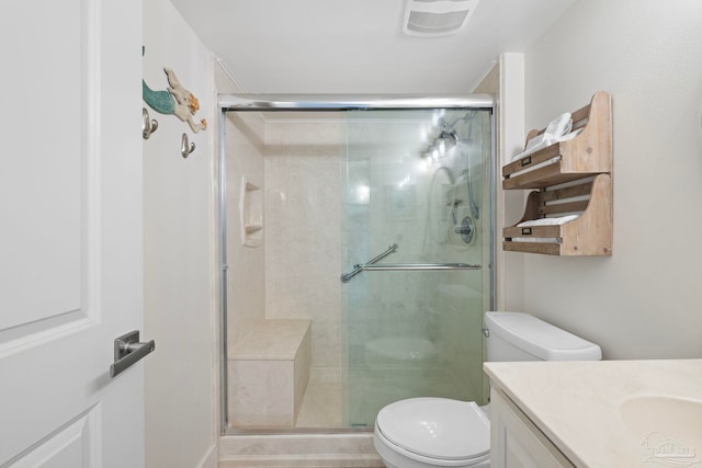 full bathroom with a stall shower, visible vents, toilet, and vanity