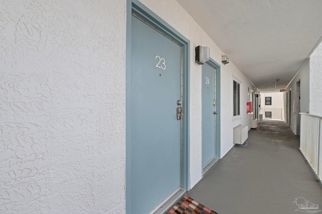 property entrance featuring stucco siding