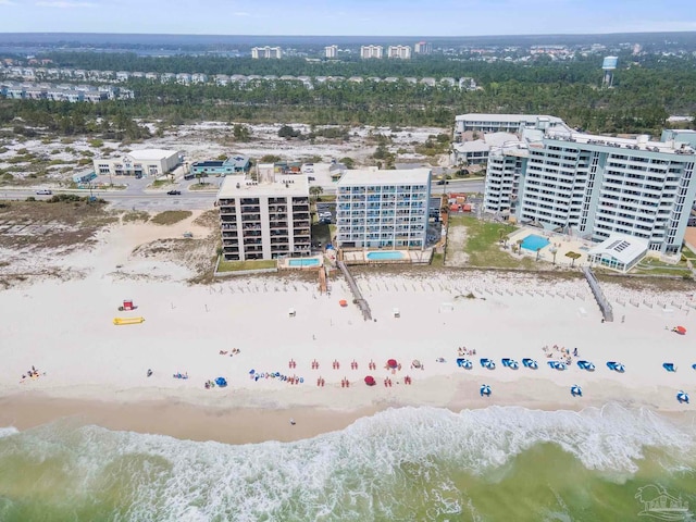 bird's eye view with a view of the beach, a water view, and a view of city