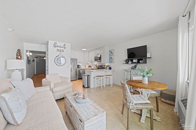 living area featuring light tile patterned floors