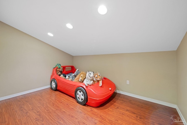 6781 Generals Ln, Pace, FL 32571 - playroom with wood finished floors, recessed lighting, and lofted ceiling