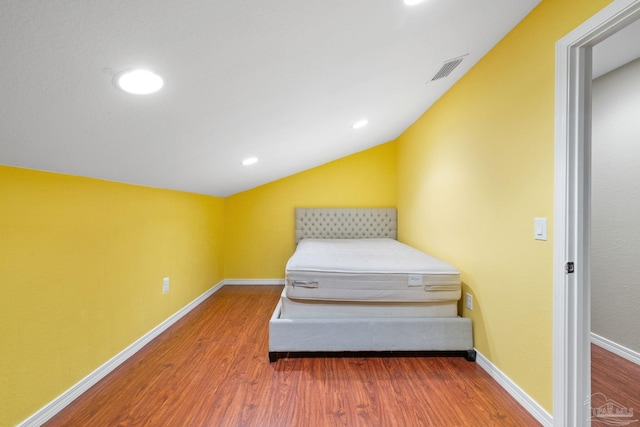 6781 Generals Ln, Pace, FL 32571 - bedroom featuring wood finished floors, lofted ceiling, and recessed lighting