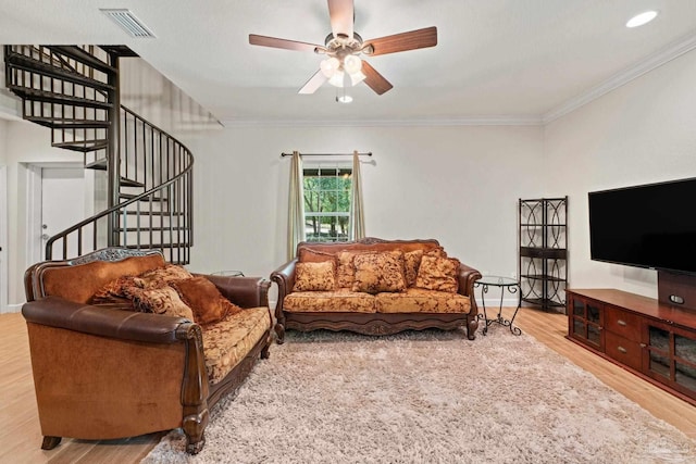 6781 Generals Ln, Pace, FL 32571 - living area with stairs, ceiling fan, wood finished floors, and crown molding