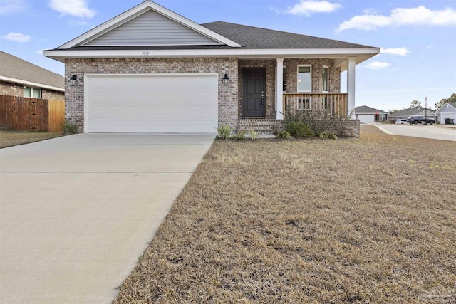 view of front of house with a garage, a front lawn, and a porch