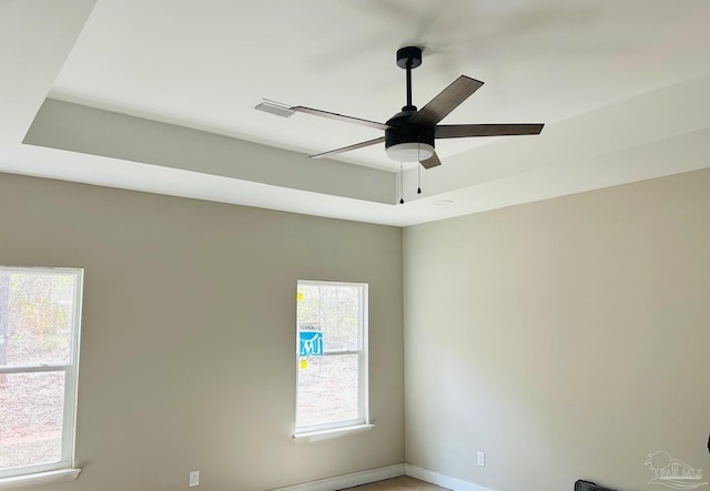 interior details with a ceiling fan, visible vents, and baseboards