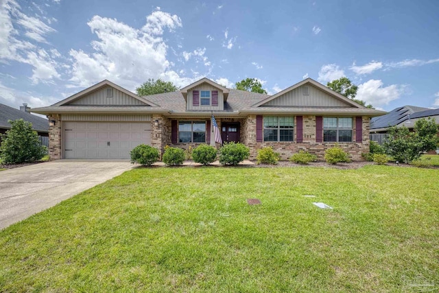 view of front of home with a garage, driveway, a front lawn, and brick siding