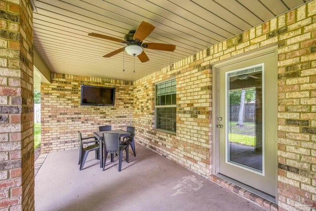 view of patio / terrace with ceiling fan and outdoor dining area