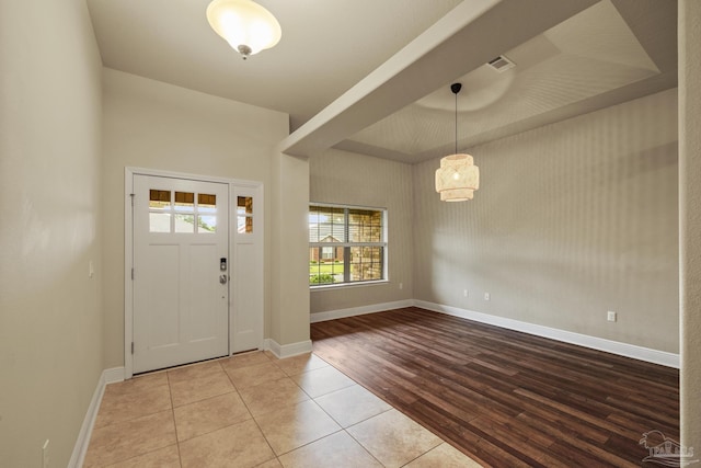 tiled entryway featuring baseboards