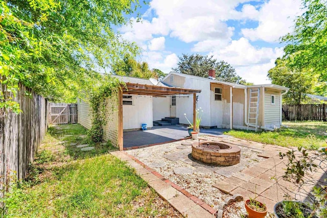 407 Rue Max St, Pensacola, FL 32507 - view of patio / terrace with an outdoor fire pit and a fenced backyard