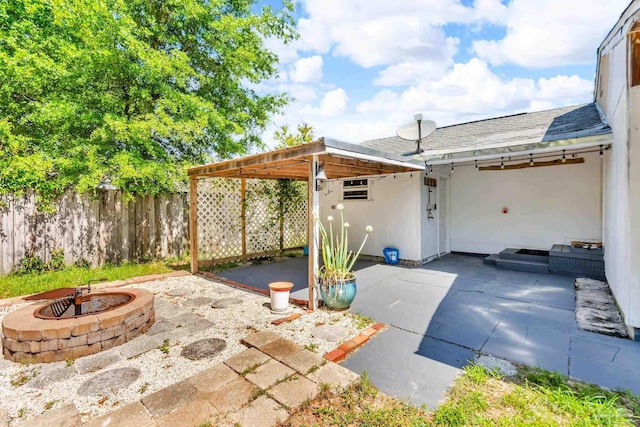 407 Rue Max St, Pensacola, FL 32507 - view of patio / terrace featuring an outdoor fire pit and fence