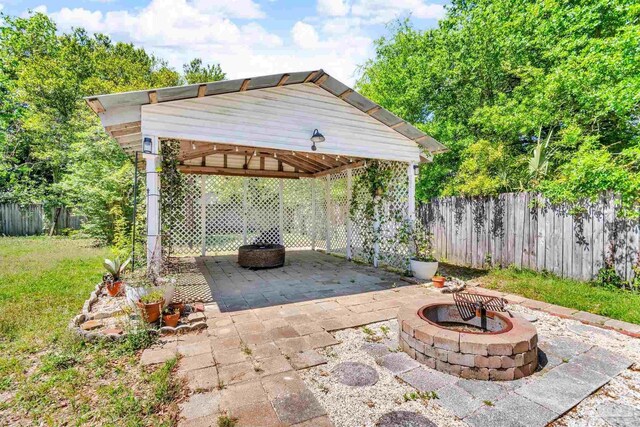 407 Rue Max St, Pensacola, FL 32507 - view of patio featuring an outdoor fire pit and a gazebo