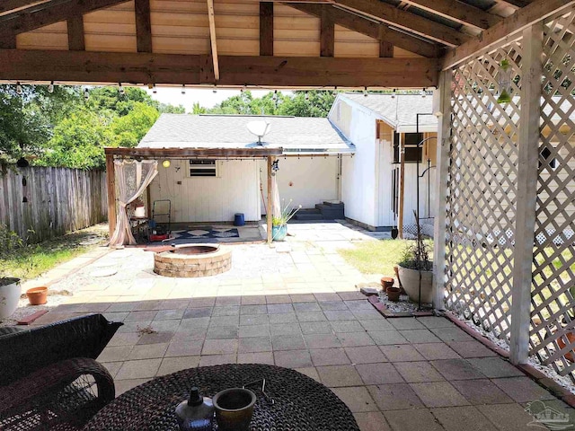 407 Rue Max St, Pensacola, FL 32507 - view of patio / terrace with an outdoor fire pit, a fenced backyard, and an outdoor structure