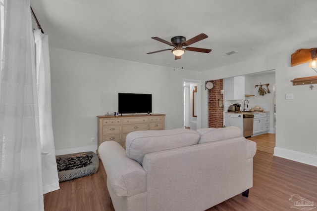 407 Rue Max St, Pensacola, FL 32507 - living room with a ceiling fan, wood finished floors, and baseboards