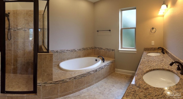 bathroom with shower with separate bathtub, tile patterned flooring, and vanity