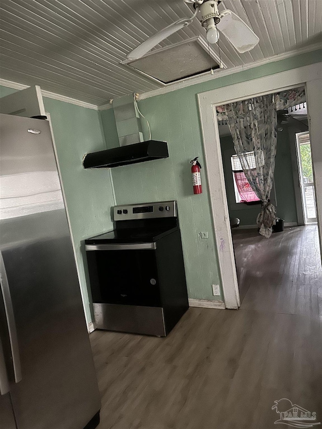 kitchen with hardwood / wood-style flooring, ornamental molding, and appliances with stainless steel finishes